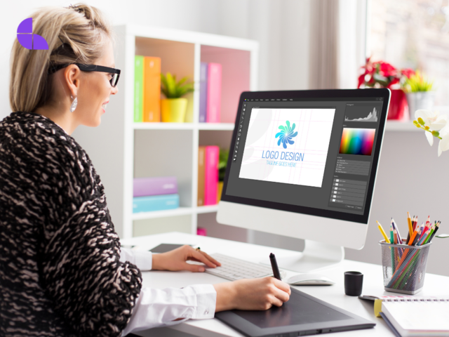 A graphic designer designing a logo using a CAD software